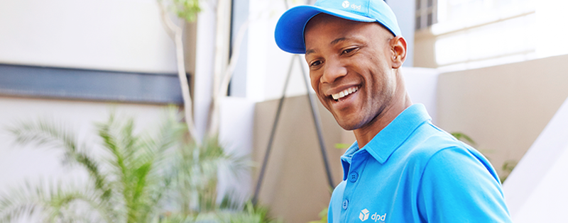 Amiable DPD courier helping customers