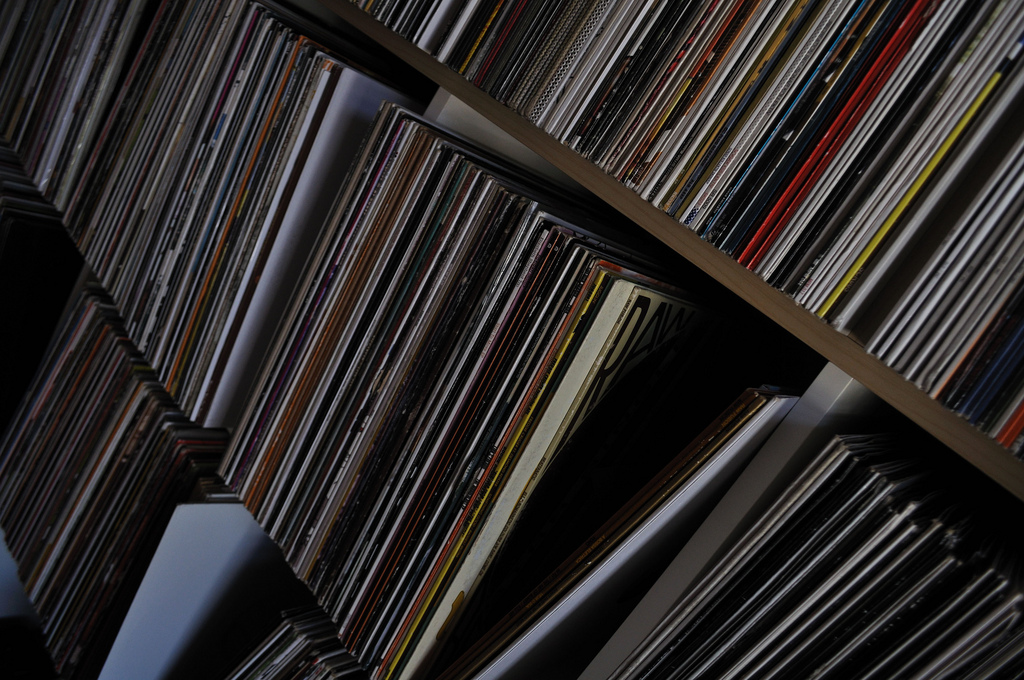 Vinyl records sitting on a shelf