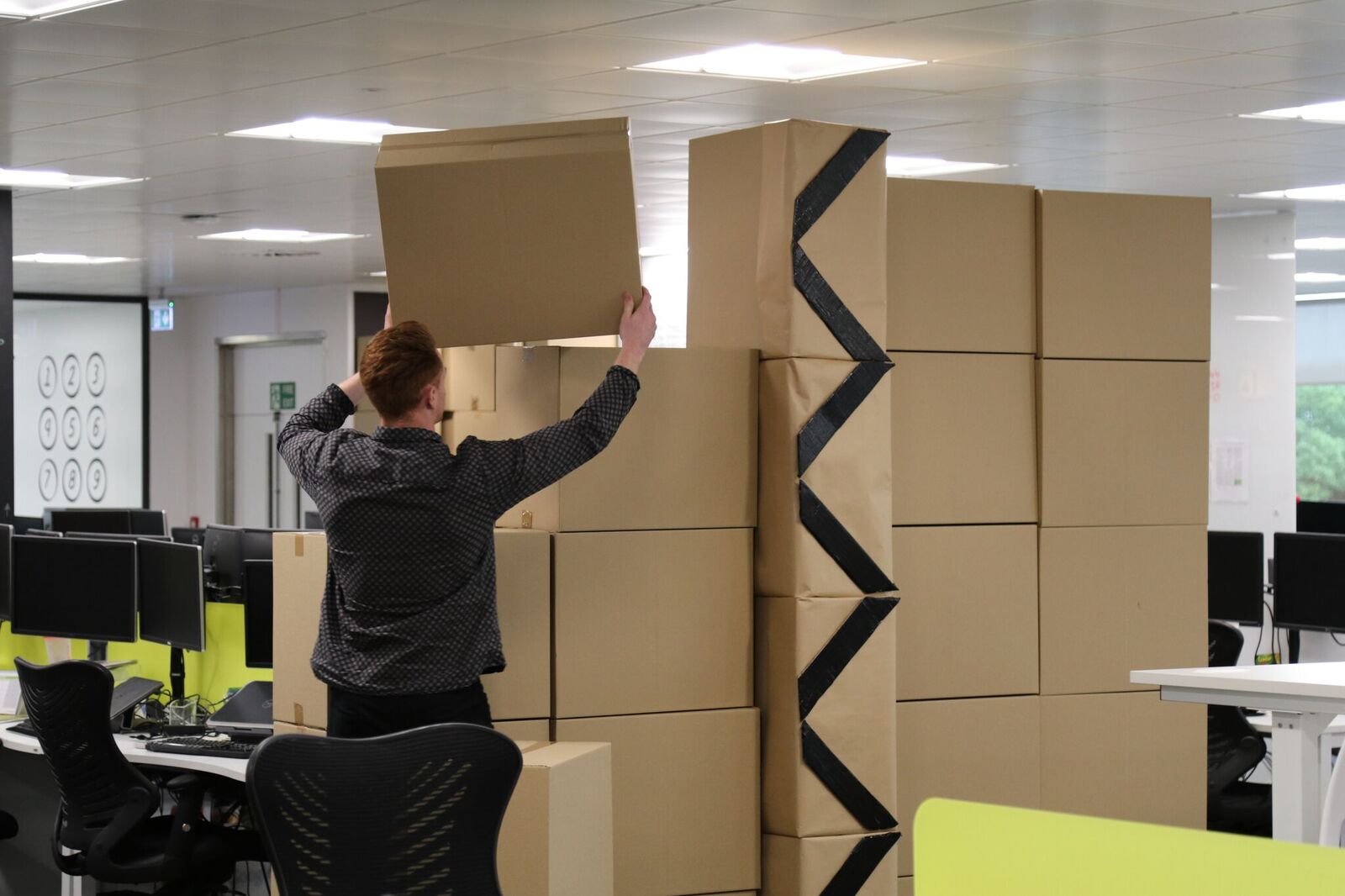 The boxes are put together to create the wall.