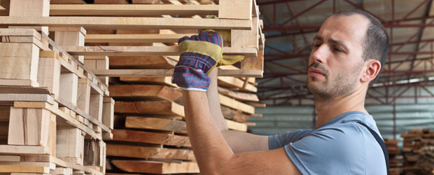 Man carefully arranging pallets